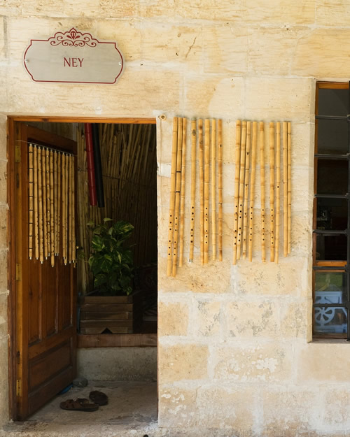 Traditional Bamboo Flutes Hanging Outside a Bamboo Flute Maker Shop